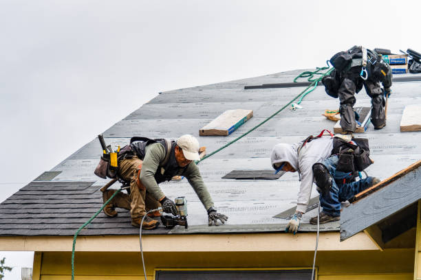 Professional Gutter Installation technician working in Medford, NY